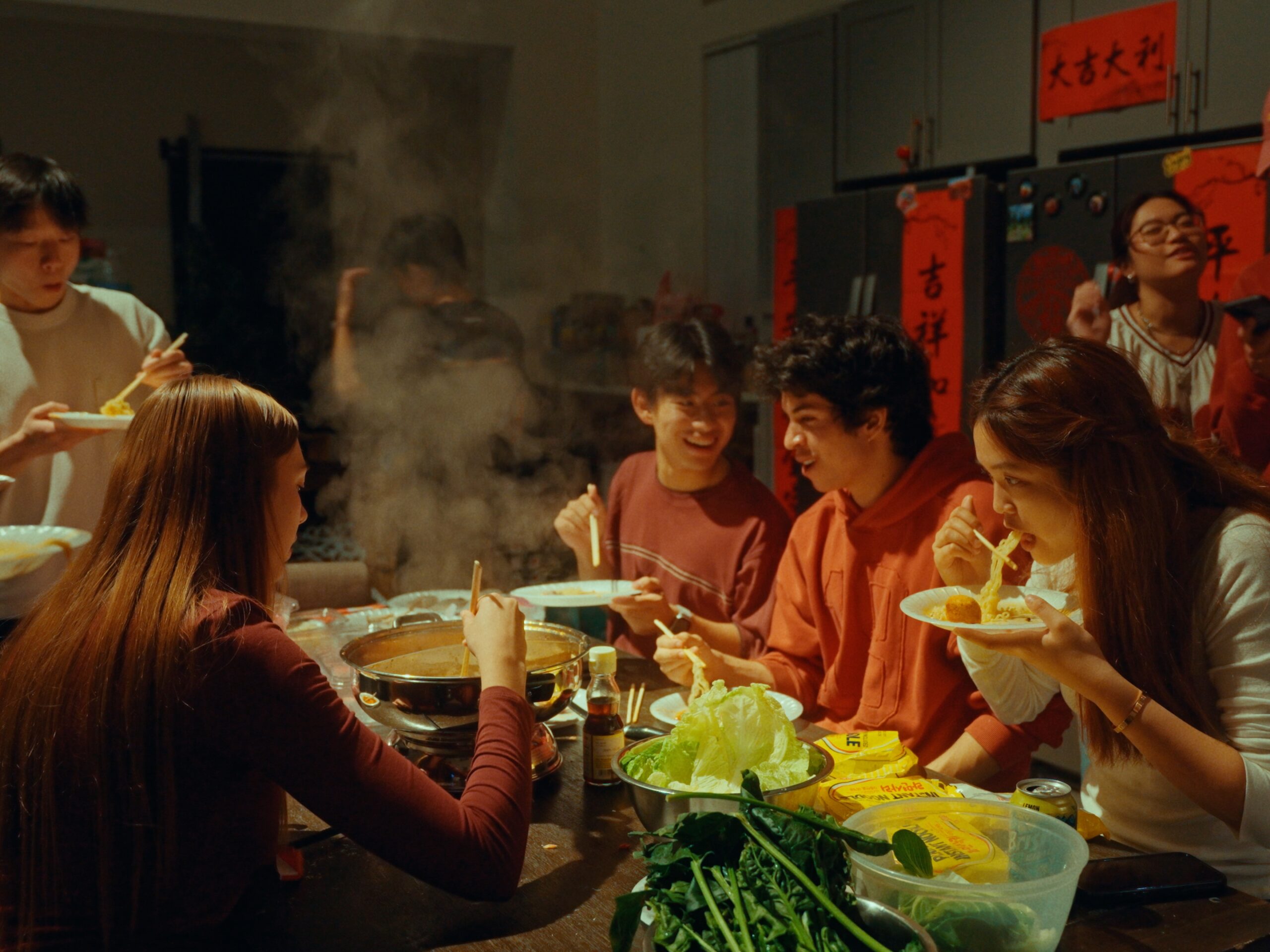 Friends sharing a warm meal around a table